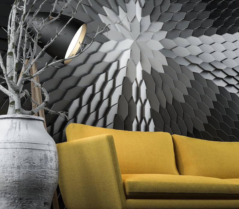 A modern living room featuring a bright geometric accent wall made of MABEL polygon 3D wall panels, installed behind a contemporary sofa.