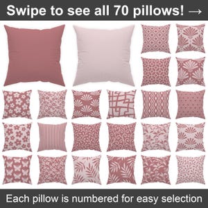 Puede incluir: Una colección de 20 cojines decorativos con varios diseños y colores. Los cojines presentan patrones florales, geométricos y botánicos en tonos rosa y blanco. El texto en la parte superior dice "Swipe to see all 70 pillows!" y en la parte inferior "Each pillow is numbered for easy selection."