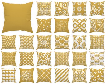 May include: A collection of 70 mustard yellow throw pillows with white geometric patterns. "Swipe to see all 70 pillows!" is written at the top of the image. "Each pillow is numbered for easy selection" is written at the bottom of the image.