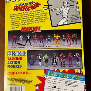 May include: A colorful card featuring the Amazing Spider-Man, a Marvel superhero. The card includes a description of Spider-Man's abilities and a list of other Marvel superheroes. The back of the card features a subscription offer for Marvel comics.