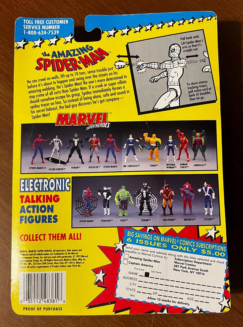May include: A colorful card featuring the Amazing Spider-Man, a Marvel superhero. The card includes a description of Spider-Man's abilities and a list of other Marvel superheroes. The back of the card features a subscription offer for Marvel comics.