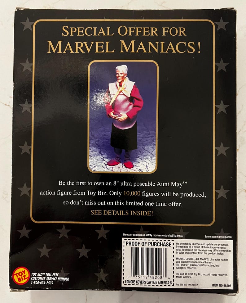 May include: Aunt May action figure from Toy Biz. The packaging features the text "SPECIAL OFFER FOR MARVEL MANIACS!" and "Be the first to own an 8" ultra poseable Aunt May action figure." The box is black with gold accents and star patterns.