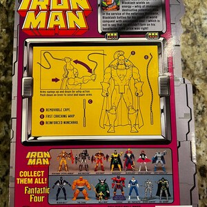 May include: Back of an Iron Man action figure package featuring Blacklash. The package has a purple and yellow color scheme with illustrations of the character and other figures. Includes the text "Collect Them All! Fantastic Four."