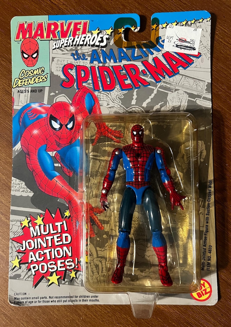 May include: A red and blue plastic action figure of Spider-Man with multi-jointed limbs. The figure is packaged in a plastic blister pack with a cardboard backing. The packaging features a comic book style image of Spider-Man and the text "The Amazing Spider-Man".