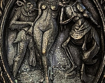 Death and the Devil accompany brass charm