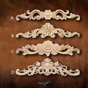 May include: Four intricately carved wooden decorative elements, labeled A, B, C, and D. Each features a unique design with floral and scrollwork patterns. The wood has a natural, unfinished appearance, showcasing the detailed craftsmanship.