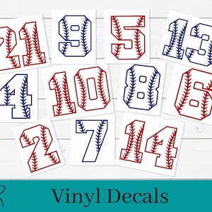May include: A set of ten baseball-themed vinyl decals featuring the numbers 1 through 14. The numbers are red and blue with a white baseball stitch pattern.
