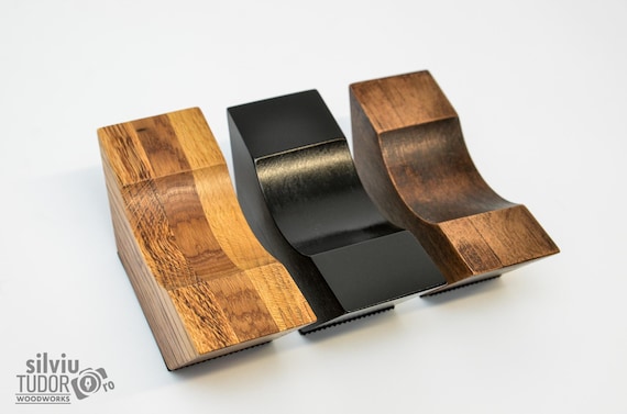 Solid wood cable risers handcrafted in Europe for audiophiles — gloriously niche, beautifully pointless to most people, and exactly perfect for one very specific person.