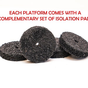 May include: Four black round isolation pads for a woodworking platform.  Each platform comes with a complementary set of isolation pads.