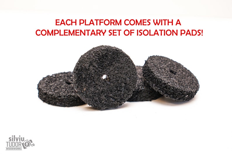 May include: Four black round isolation pads for a woodworking platform.  Each platform comes with a complementary set of isolation pads.