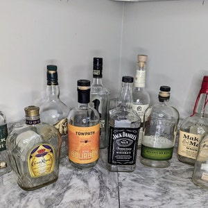 Empty Bourbon and Whiskey Liquor Bottles With Lids