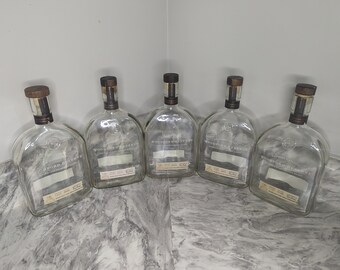 Set of 5-Woodford Bourbon Bottles with lids.