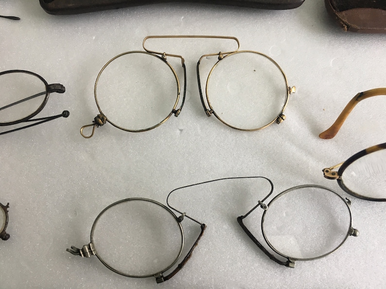 6 old spectacles and 5 vintage glasses cases
