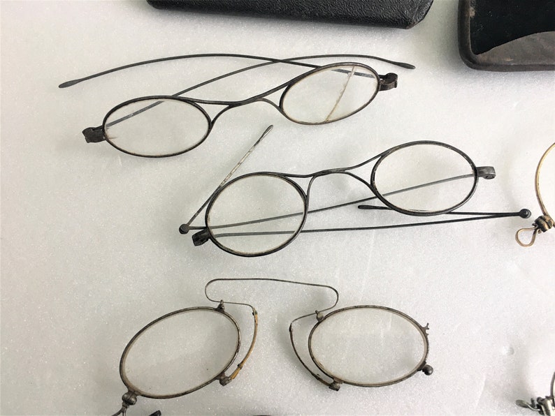6 old spectacles and 5 vintage glasses cases