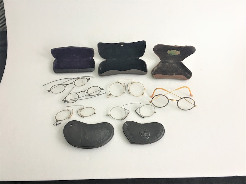 6 old spectacles and 5 vintage glasses cases