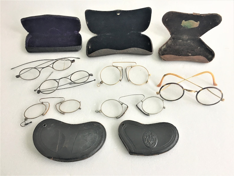 6 old spectacles and 5 vintage glasses cases