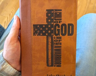 Personalized NIV Bible | American Flag Cross | Custom Engraved Name | Large Print | A Child of God A Man of Faith A Warrior of Christ