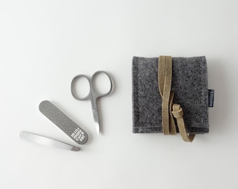 Mini manicure set 'ella' with scissors nail file tweezers made of organic felt dark gray with closure strap made of organic leather in many colors