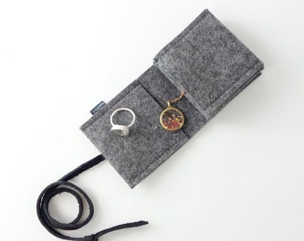 minimalist jewelry storage organic wool felt 'schmucknest' small dark gray with closure strap made of organic leather different colors