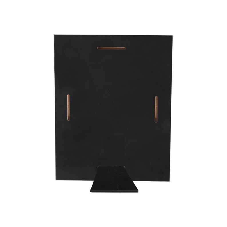 May include: A black wooden picture frame with a built-in easel stand. The back of the frame has a rectangular shape with a horizontal slot and two vertical slots. The easel is a small, black, triangular piece attached to the bottom.