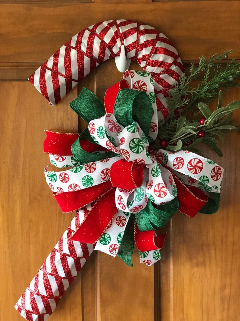 Handcrafted Red /& White Christmas Candy Cane Wreath Decorated with a Accent Bow and Greenery Accents