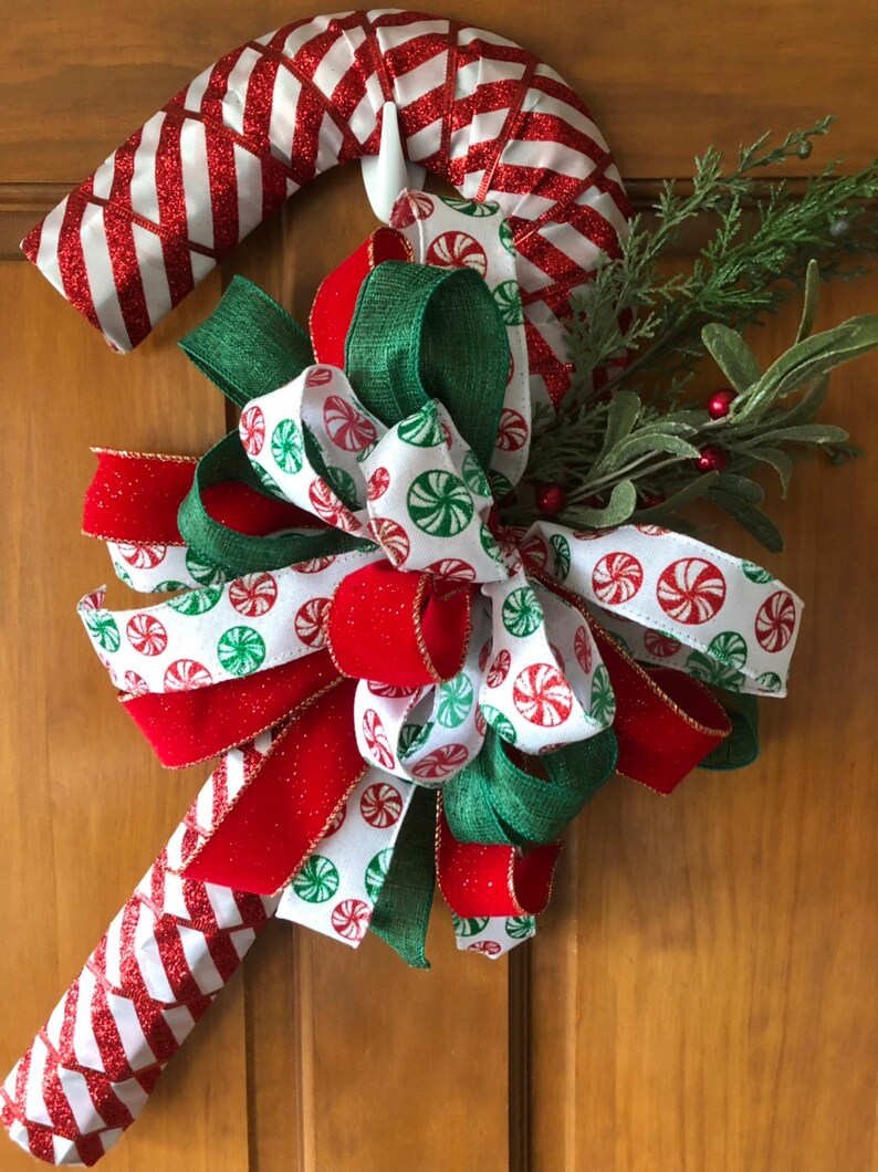 Handcrafted Red /& White Christmas Candy Cane Wreath Decorated with a Accent Bow and Greenery Accents