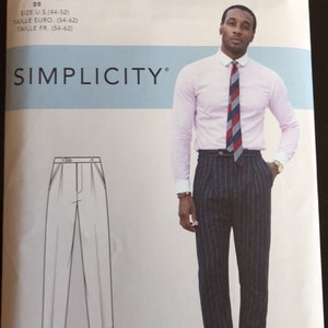 May include: Simplicity sewing pattern featuring a drawing of pleated trousers and a photo of a person wearing a pink shirt, striped tie, and pinstripe trousers. The pattern is labeled "Mimi G Style" and includes size information.