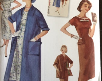 May include: Simplicity sewing pattern S8980 R5, featuring vintage 1950s designs. The pattern includes illustrations of dresses and coats. Size U.S. 14-22 is indicated on the packaging. The cover art showcases women in various outfits.
