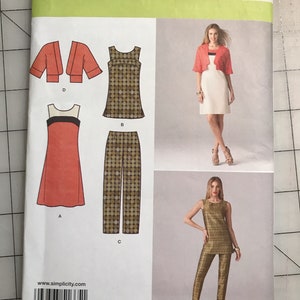May include: Simplicity sewing pattern 1665 H5 featuring designs for a dress, top, pants, and bolero jacket. The pattern includes size options for U.S. sizes 6, 8, 10, 12, and 14. The cover displays images of the finished garments.