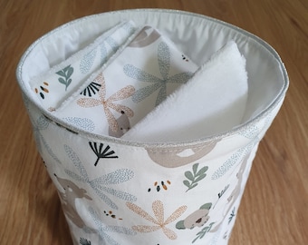 White and green koala cotton basket with an assortment of soft baby wipes
