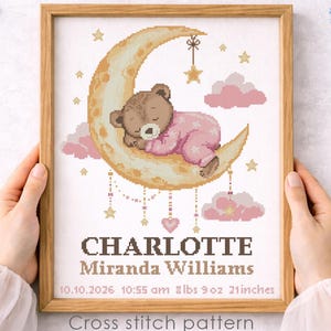 May include: Cross-stitch pattern featuring a sleeping teddy bear on a crescent moon, surrounded by stars and clouds. The framed artwork includes the name "CHARLOTTE" and birth details: 8 lbs 9 oz, 21 inches. The text "Cross stitch pattern Instant download PDF" is also included.
