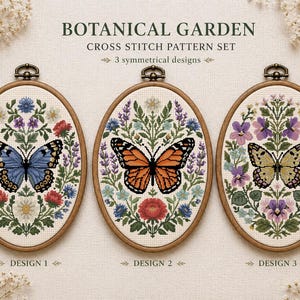 Könnte beinhalten: Drei ovale Holzstickrahmen mit Kreuzstichmustern unter dem Titel BOTANICAL GARDEN CROSS STITCH PATTERN SET. Jeder Rahmen zeigt einen zentralen Schmetterling, umgeben von farbenfrohen Blumenarrangements, beschriftet als Design 1, 2 und 3.