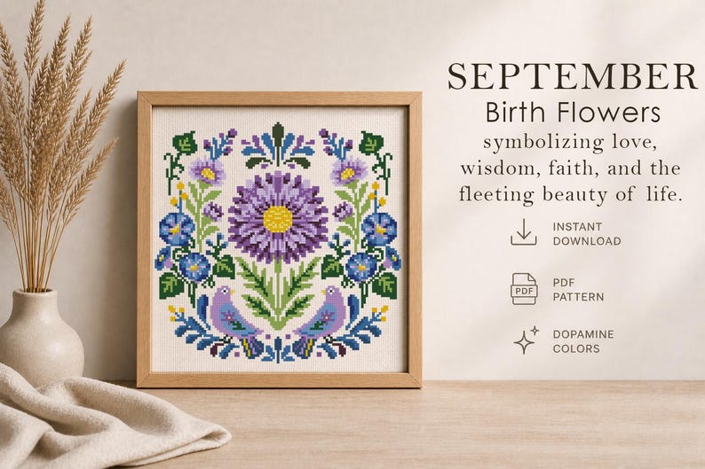 May include: A framed cross-stitch pattern featuring a floral design with a large purple flower at the center, surrounded by blue and green accents. The text reads "SEPTEMBER Birth Flowers".