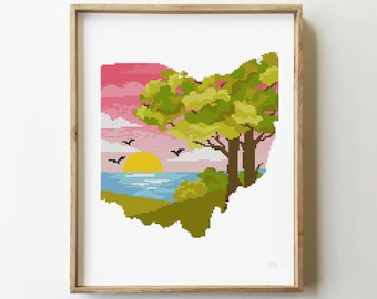 May include: Cross stitch pattern of the state of Ohio with a sunset over a lake and a green tree in the foreground.