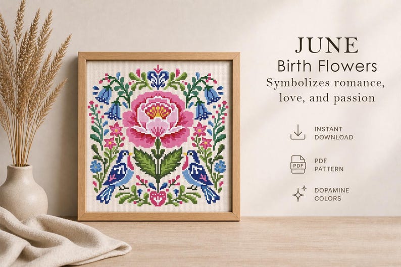 May include: A framed cross-stitch pattern featuring a large pink flower, blue birds, and floral elements. The text reads "JUNE Birth Flowers" and "Symbolizes romance, love, and passion." The design is in a wooden frame.