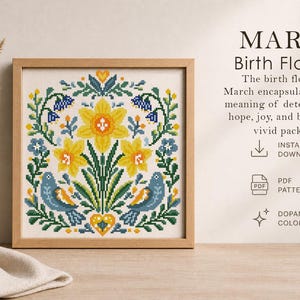 May include: A framed cross-stitch pattern featuring yellow daffodils, blue birds, and green foliage. The text reads "MARCH Birth Flowers" and describes the flower's meaning. The design is a digital PDF download.