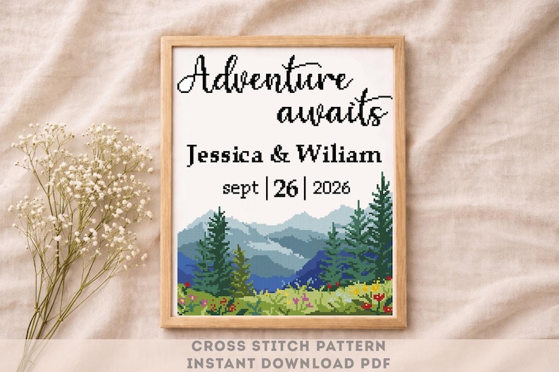 May include: A framed cross-stitch pattern with the words "Adventure awaits" above the names "Jessica & Wiliam" and the date "sept | 26 | 2026". The design features a mountain landscape with trees and flowers. The text "CROSS STITCH PATTERN INSTANT DOWNLOAD PDF" is at the bottom.