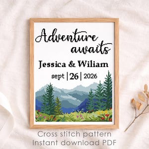 May include: A framed cross-stitch pattern with the words "Adventure awaits" above the names Jessica & Wiliam and the date Sept 26, 2026. The design features a mountain landscape with trees and flowers. The text "Cross stitch pattern Instant download PDF" is at the bottom.