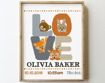 May include: Cross-stitch pattern featuring the word "LOVE" with animal illustrations in each letter. The letters are in shades of gray, orange, and brown. The name "Olivia Baker" is below the word "LOVE" along with the date "10.10.2018", time "10:55am", and weight "7lbs. 8oz."