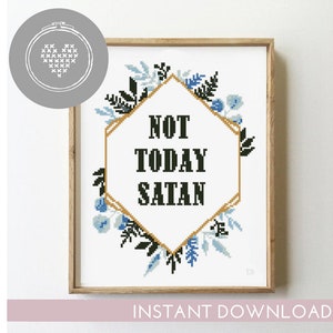 May include: Cross stitch pattern featuring a hexagonal frame with the text "NOT TODAY SATAN" in black lettering. The frame is surrounded by blue and green floral designs.