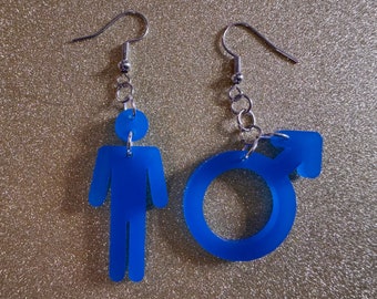May include: A pair of blue acrylic earrings. One earring is shaped like a stick figure person, the other is shaped like the male symbol.