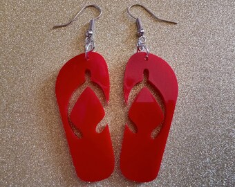 May include: A pair of red flip-flop earrings with silver hooks.