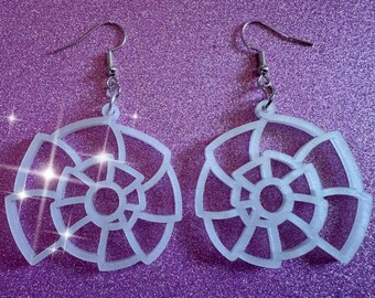 May include: A pair of white shell-shaped earrings with a delicate, intricate design. The earrings are made of a translucent material and have silver hooks.