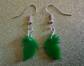 May include: A pair of green bird-shaped earrings with silver hooks.