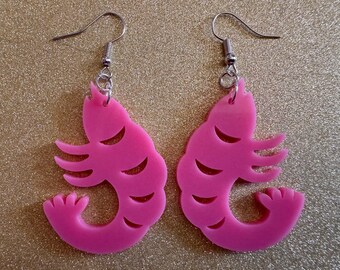 May include: A pair of pink shrimp-shaped earrings with silver hooks.