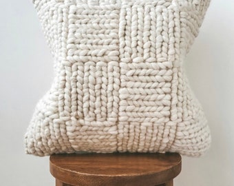 white sweater pillow