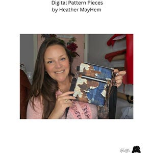 May include: A two zip crossbody bag featuring a cow print and blue denim patchwork design with frayed edges. The bag includes a black adjustable strap and silver hardware. The text reads: Two Zip Crossbody Bag Digital Pattern Pieces by Heather MayHem.