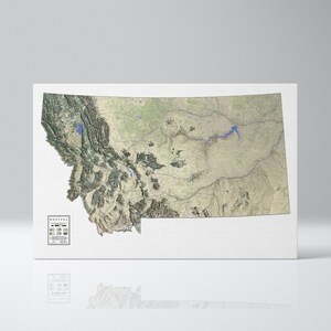Puede incluir: Un mapa topográfico detallado de Montana, que muestra el terreno diverso del estado, incluyendo montañas, valles y ríos. El mapa está impreso sobre un fondo blanco y tiene una superficie sutilmente texturizada.