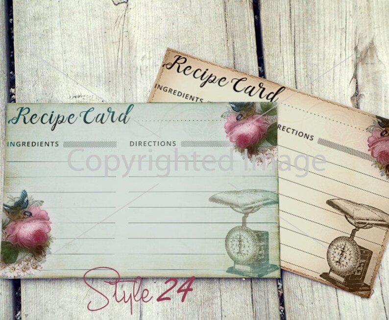 May include: Two vintage-style recipe cards with a blue and white floral design. The cards have lines for ingredients and directions. The cards feature a scale with a pink rose and a blue bird.