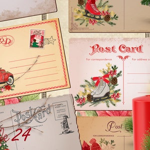 May include: A collection of vintage Christmas postcards with red and white designs. The postcards feature images of a red truck carrying presents, ice skates, and a Christmas tree. The postcards are surrounded by pine branches, a red candle, and a red Christmas bauble.